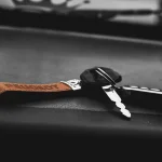 Car keys on a dark leather seat, car key service