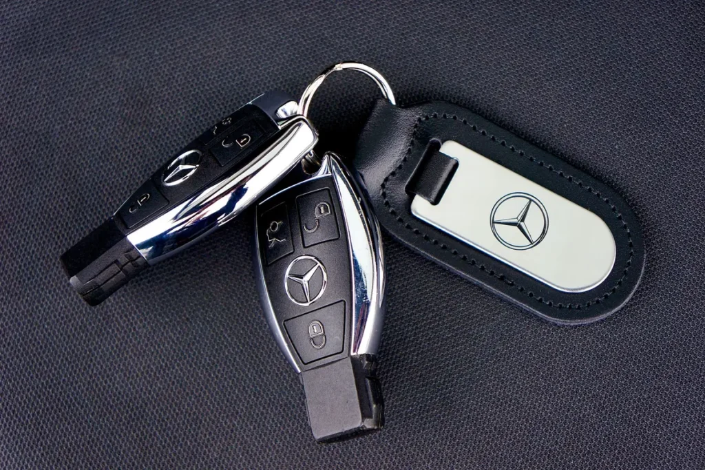 Car key fobs on a dark surface, programmed car keys