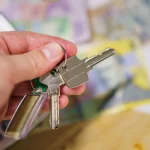 Hands handing over keys, key copies in Anderson