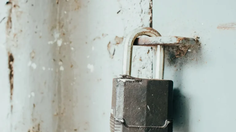 Rusty padlock on a weathered door, lock repair in Anderson, SC