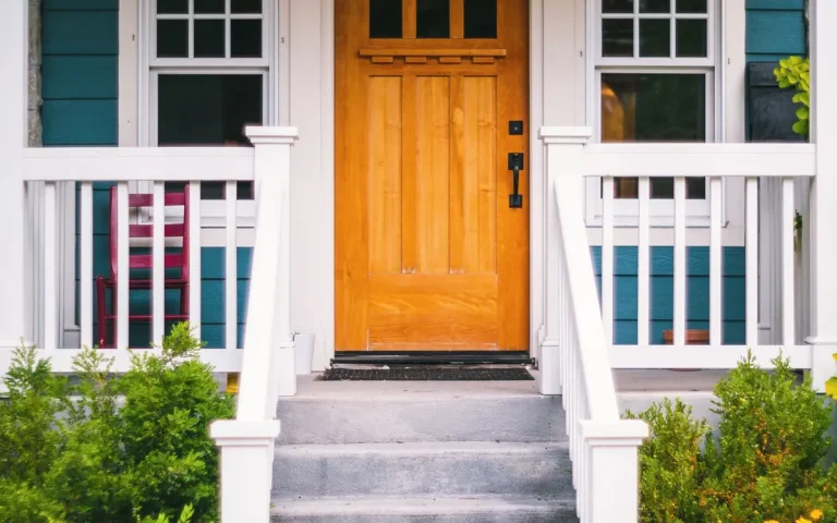 Home with a white porch and dark front door, locksmith in Williamston, SC
